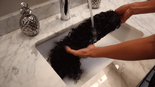Submerge the Wig in the water after turning it inside out.